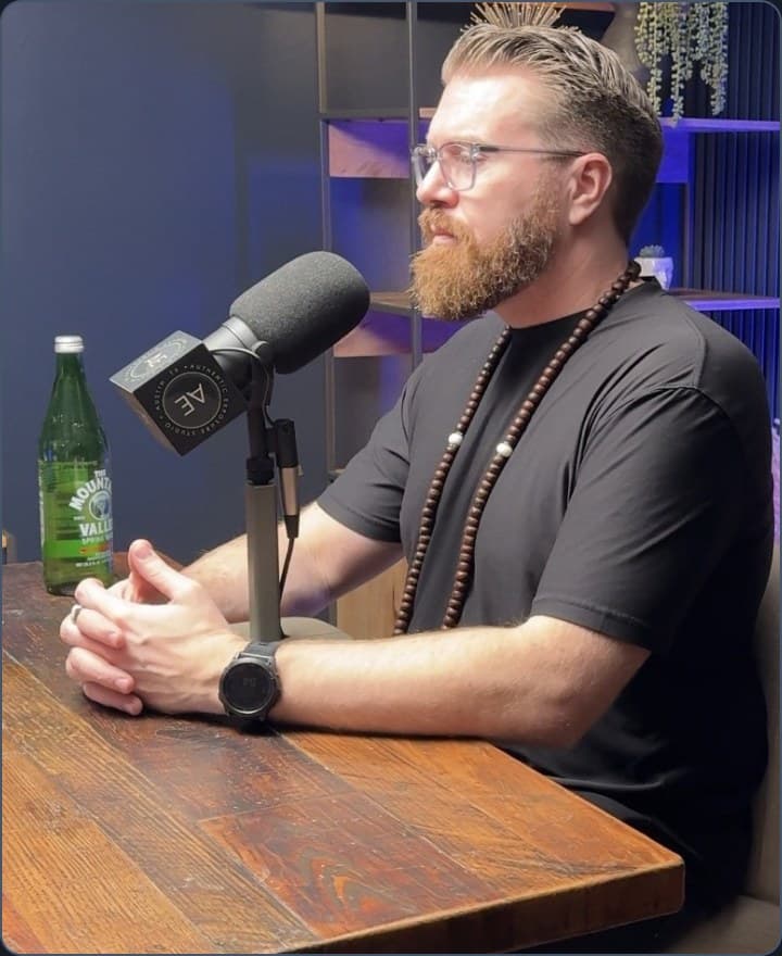 Will Rezin speaking into a microphone